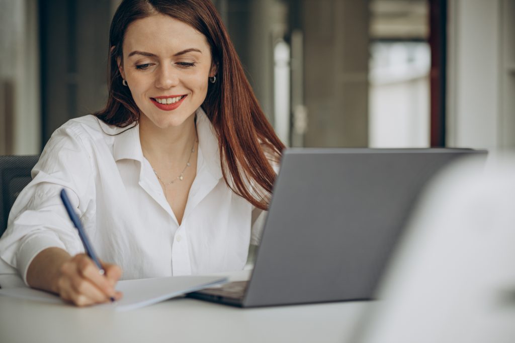 Woman working in office on a computer